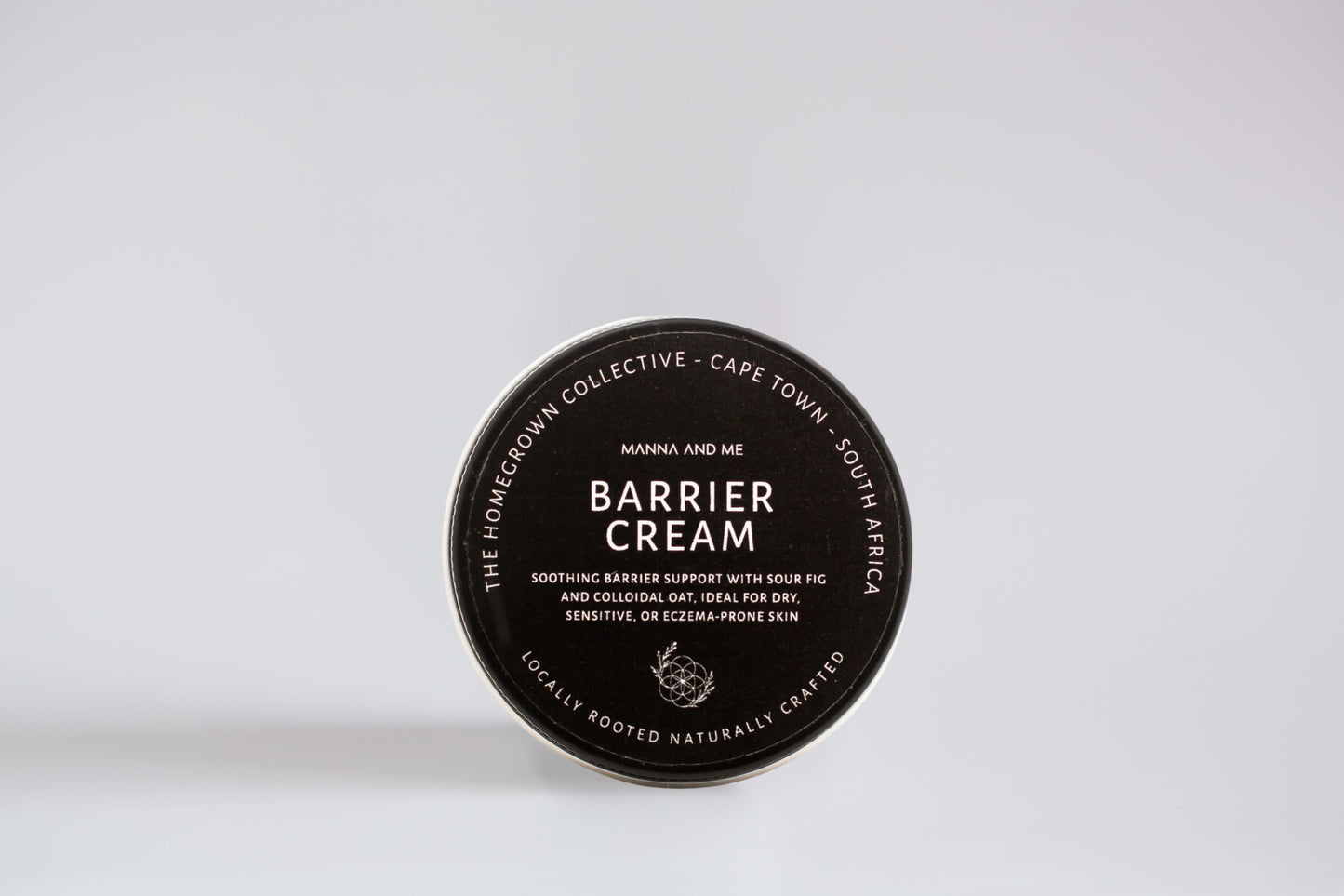 Manna and Me Barrier Cream in a glass jar, a family-safe natural skin food for soothing dry, irritated, and eczema-prone skin.