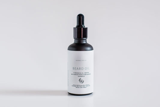 Manna and Me natural Beard Oil bottle with dropper, a soothing conditioning treatment crafted to prevent under-beard dryness and skin irritation.