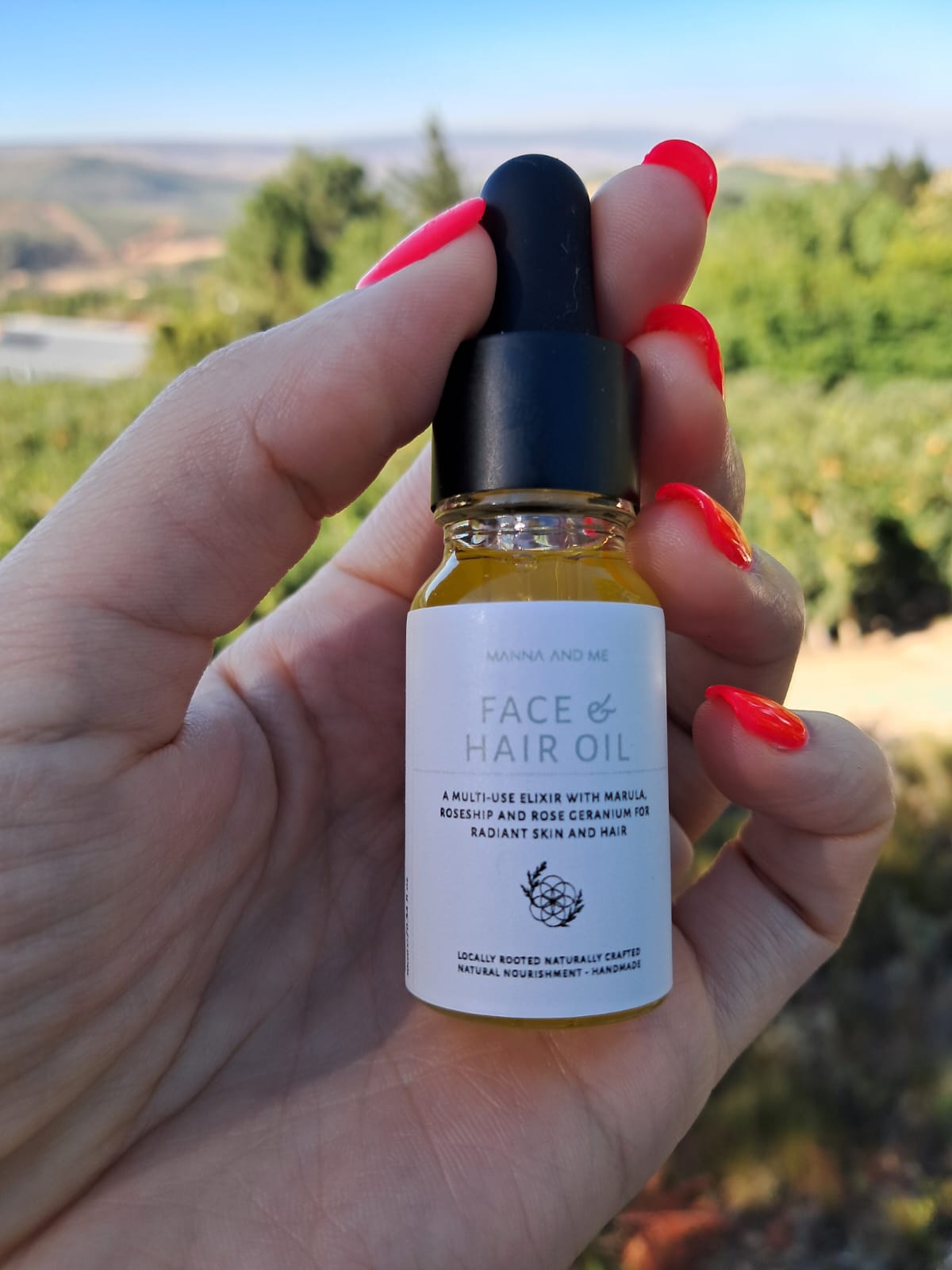 Manna and Me concentrated Face & Hair Oil dropper bottle, restorative South African botanical blend.